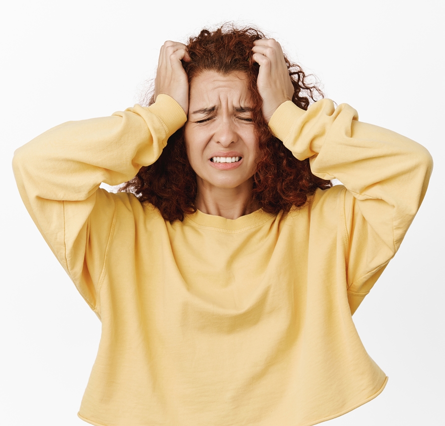 Image of troubled, frustrated redhead woman hold hands on head and grimacing in despair, distressed, bad concerning news, standing anxious over white background.